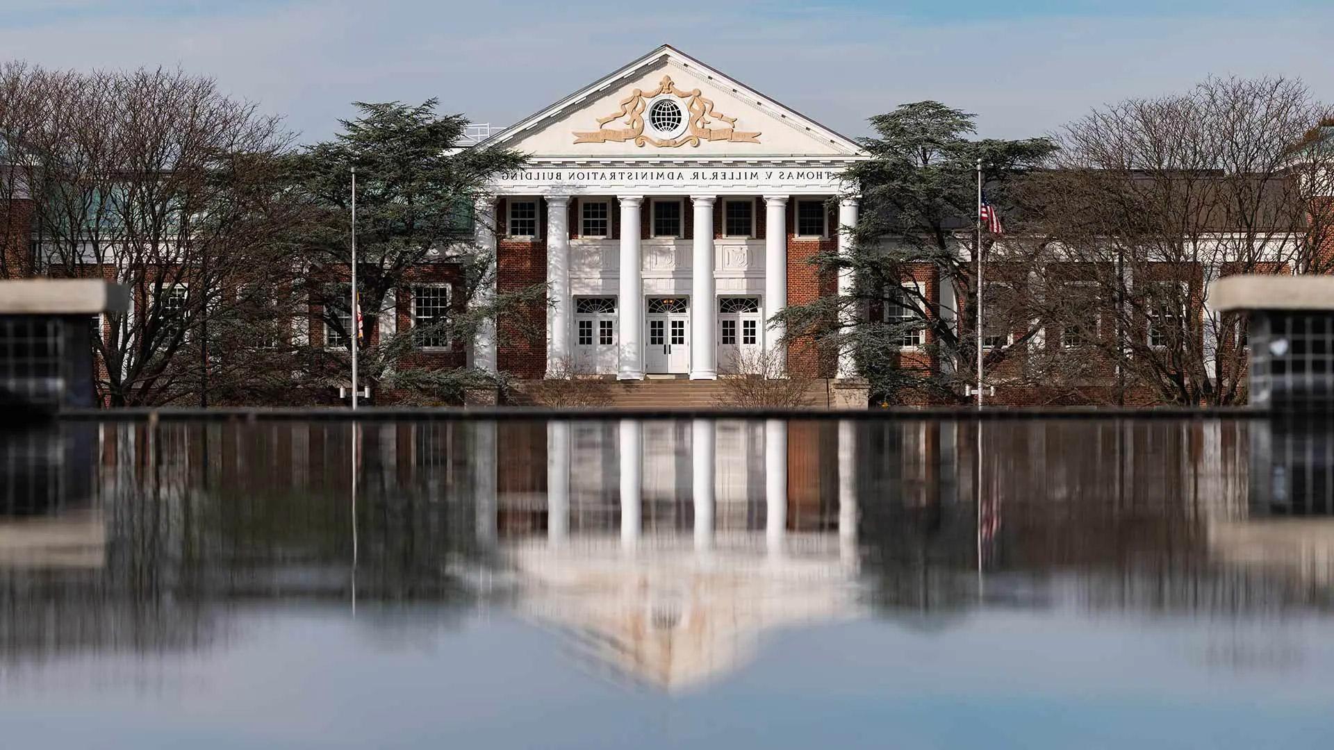Thomas V. Miller Main Admin Building seen from the low perspective of the reflecting pool